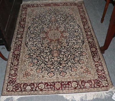 Lot 1491 - Chinese silk rug, the field of flowering vines around a flowerhead medallion framed by...