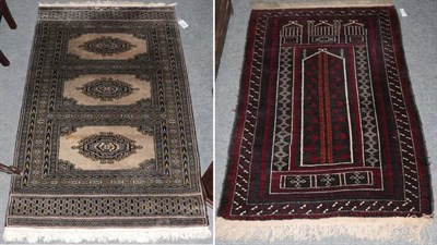 Lot 1497 - Balouch prayer rug West Afghanistan, the ''Tree of Life'' field beneath a stepped Mihrab...