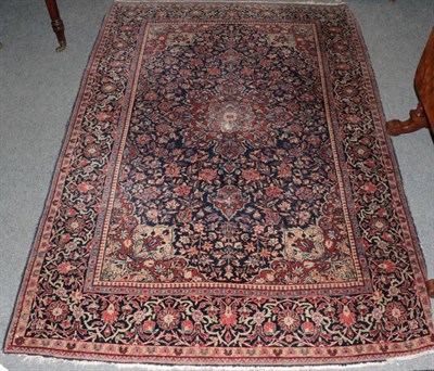 Lot 1498 - Kashan rug, Central Iran, the indigo field with madder flower head medallion, framed by...