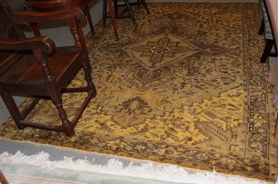 Lot 1501 - Heriz design rug, the gold field centred by a cruciform medallion, enclosed by borders