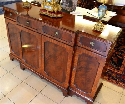 Lot 1510 - Charles Barr mahogany breakfront sideboard, modern, with four drawers above four cupboard doors