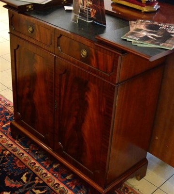 Lot 1511 - Charles Barr reproduction mahogany serving cabinet, with two hinged leaves above two drawers...