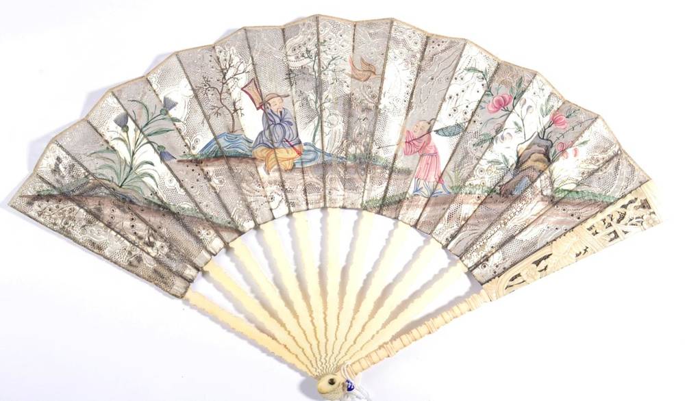 Lot 10 - A Mid-18th Century Fan in the Chinoiserie Style, découpé, the single paper leaf in silver and...