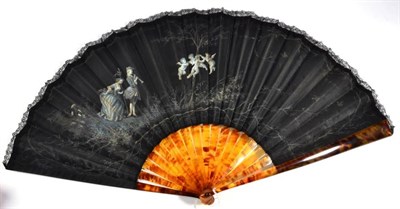 Lot 65 - A Circa 1875 Fan, with a painted black silk leaf, edged with black Chantilly lace, mounted à...