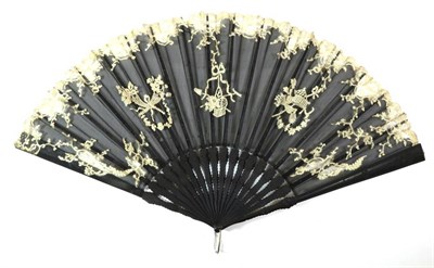 Lot 71 - A Circa 1900-10 Fan, the leaf of black net embroidered with sprays of iris and leaves and...
