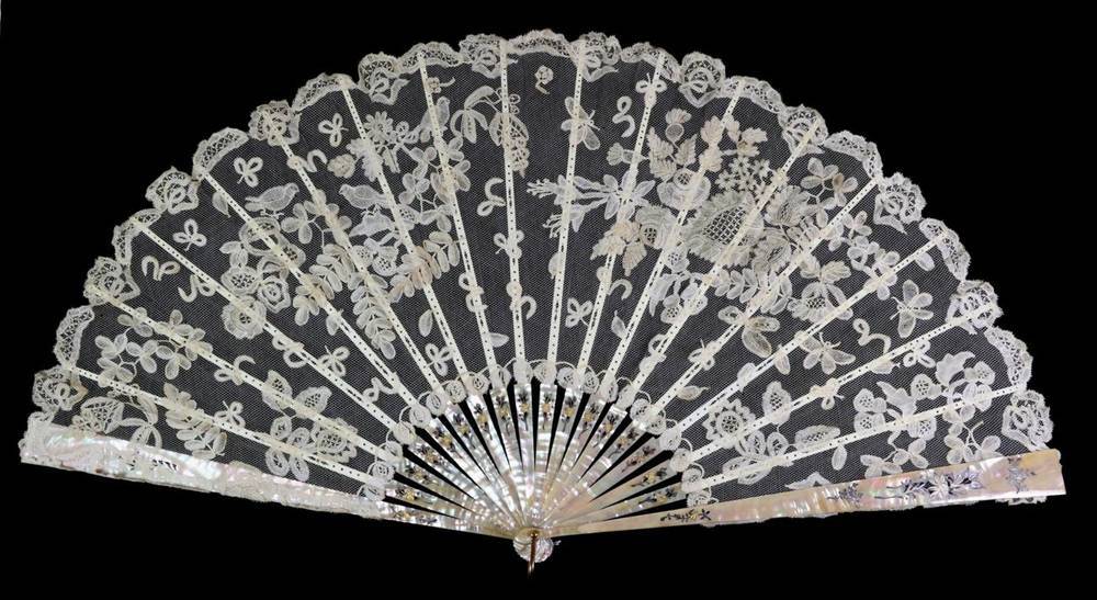 Lot 73 - A Large Circa 1890's Honiton Lace Fan, mounted on silvered and gilded pink mother-of-pearl...
