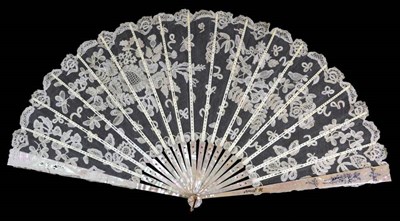 Lot 73 - A Large Circa 1890's Honiton Lace Fan, mounted on silvered and gilded pink mother-of-pearl...