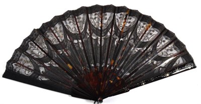 Lot 113 - A Circa 1905 Tortoiseshell Fan, the monture piqué, the black gauze leaf decorated in swags...