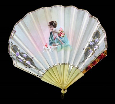 Lot 114 - A 1920's Fan of Fontange Form, the cream silk leaf mounted à l'Anglaise on resin sticks dyed...