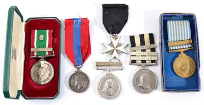 Lot 9 - A Serving Brother Breast Badge to the Order of St John, and two Service Medals, one with three bars