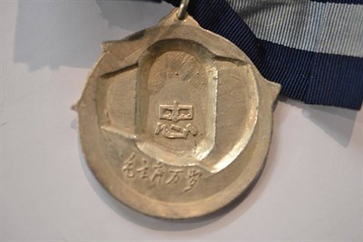 Lot 42 - A Chinese National Medal of Honour, Naval Issue, in silver with navy blue and sky blue ribbon...