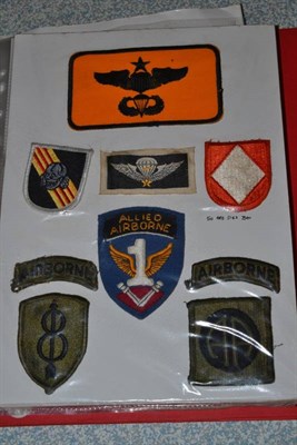 Lot 136 - A Collection of US Army Cloth Insignia and Badges, to the Airborne divisions, comprising eighty...
