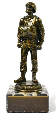 Lot 214 - The Parachute Regiment - A Bronzed Metal Figure of a Paratrooper, standing on a grey and black...