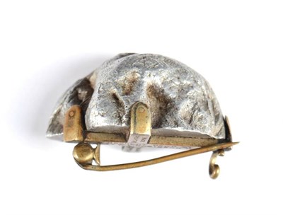 Lot 215 - A First World War Aluminium Brooch, the brass cruciform frame inscribed 'MADE FROM THE BURNT...