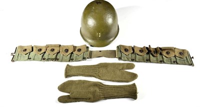 Lot 237 - A US M-1 Steel Combat Helmet, possibly Korean War period, the green painted finish with traces...
