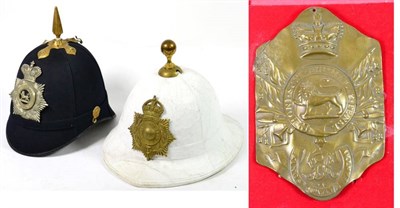 Lot 238 - A Home Service Blue Cloth Helmet, with brass spike and ear rosettes, later set with a white...