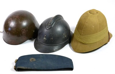 Lot 240 - A First World War French M15 Adrian Helmet, with blue paint, the badge lacking the flaming grenade