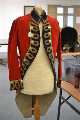 Lot 250 - An 18th Century Style Scarlet Coatee, with blue front facings, cuffs and stand-up collar, all...