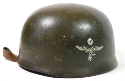 Lot 256 - A German Third Reich M1938 Fallschirmjäger (Paratrooper) Helmet, finished in green paint, with...