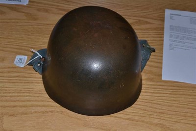 Lot 256 - A German Third Reich M1938 Fallschirmjäger (Paratrooper) Helmet, finished in green paint, with...