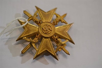 Lot 258 - A German Third Reich Spanish Cross in Gold with Swords,  with vertical sword shape pin, the...