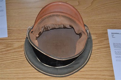 Lot 263 - A German Third Reich SS Officer's Peaked Cap, in field grey wool, with white waffenfarbe to the...