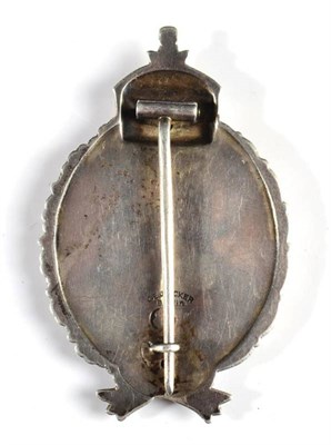 Lot 267 - A First World War Prussian Pilot's Badge by C E Juncker, Berlin, the hollow plated over back...