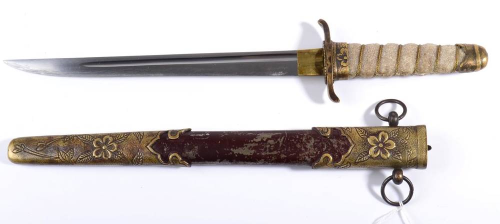 Lot 284 - A Japanese Naval Dirk, the 22.5cm single edge steel blade with a narrow fuller, the brass...