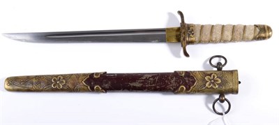 Lot 284 - A Japanese Naval Dirk, the 22.5cm single edge steel blade with a narrow fuller, the brass...