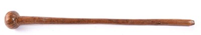 Lot 364 - A Zulu Knobkerrie, of light hard wood, the globular head with shallow wrythen carved...
