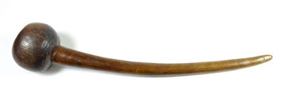 Lot 396 - A 19th Century Zulu Rhinoceros Horn Knobkerrie, the large slightly offset globular head with dished