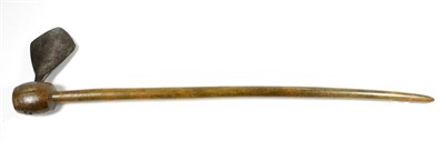 Lot 398 - A 19th Century African Rhinoceros Horn Axe, the slender slightly curved and tapering haft, with...