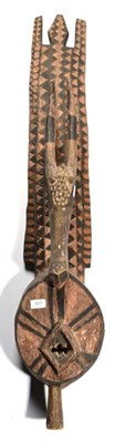 Lot 411 - A Nuna Carved and Painted Wood Antelope Plank Mask, Burkina Faso, the ocular mask decorated...