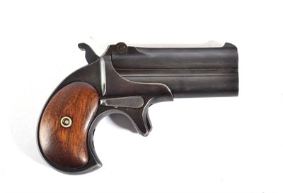 Lot 445 - A Remington Double Deringer Model 4, with blued finish, the 7.5cm over and under barrels...