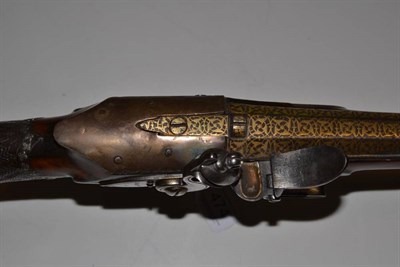 Lot 474 - A 19th Century Caucasian Flintlock Musket, the 95cm sighted octagonal damascus barrel with...