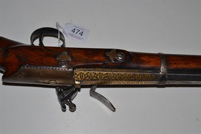 Lot 474 - A 19th Century Caucasian Flintlock Musket, the 95cm sighted octagonal damascus barrel with...