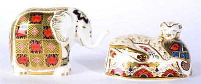 Lot 16 - A Royal Crown Derby Imari paperweight, Harrods Small Elephant and Lion Cub (2)