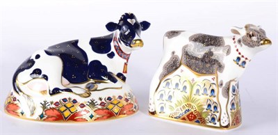 Lot 36 - Royal Crown Derby Imari paperweights, Friesian Cow 'Buttercup', together with Bluebell Calf (2)