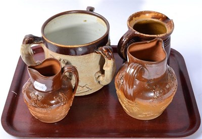 Lot 55 - A 19th century salt glazed stoneware tyg; and three similar jugs (4)