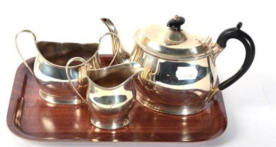Lot 61 - A three piece silver teaset stamped P E & Sons