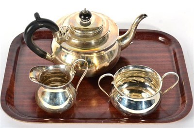 Lot 65 - A silver three piece tea service, C S Green & Co, Birmingham 1922, squat circular form, the...