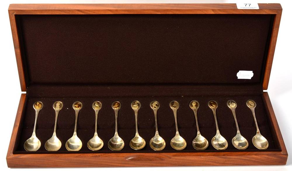Lot 77 - A set of twelve parcel gilt silver spoons for the RSPB by John Pinches, in fitted box with brochure