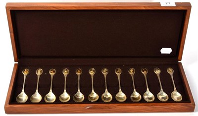 Lot 77 - A set of twelve parcel gilt silver spoons for the RSPB by John Pinches, in fitted box with brochure