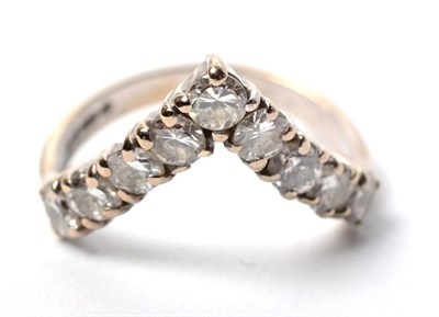 Lot 99 - An 18 carat gold diamond wishbone ring, total estimated diamond weight 0.90 carat...