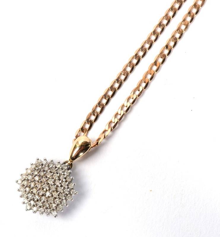 Lot 125 - A 9 carat gold diamond cluster pendant on a 9 carat gold cuban link chain necklace, 7.6g
