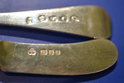 Lot 132 - A provincial or colonial silver table fork, untraced marks; a pair of Scottish fiddle pattern sugar