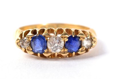 Lot 139 - An 18 carat gold sapphire and diamond ring, total estimated diamond weight 0.25 carat...