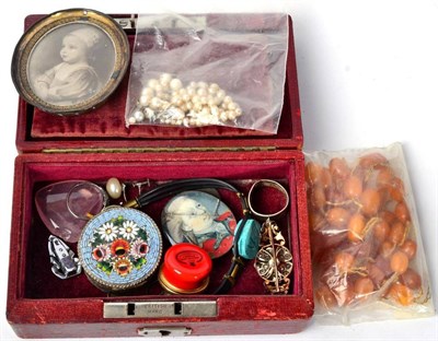 Lot 145 - A broken strand of amber beads; an oval miniature on ivory (a.f.); a Georgian paste set brooch; and