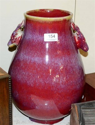 Lot 154 - A Chinese sang-de-boeuf baluster vase, with twin stag handles, 34.5cm height