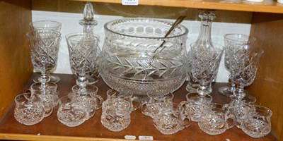 Lot 165 - A group of glass comprising a cut glass punchbowl; a George III feather edge silver soup ladle;...